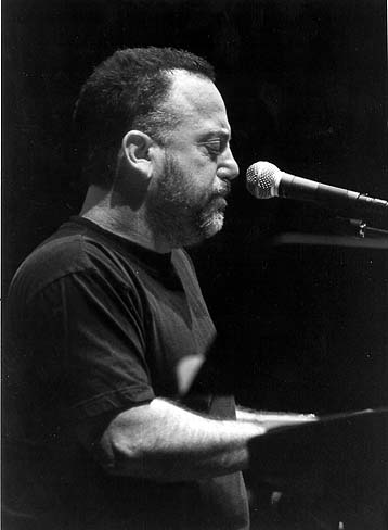 Billy Joel - William Martin 'Billy' Joel (born May 9, 1949, in Bronx, New York, USA) is an American singer, pianist, and songwriter. He released his first hit song, 'Piano Man', in 1973. According to the RIAA, he is the seventh best selling artist in the United States. Joel had Top 10 hits in the '70s, '80s, and '90s, is a six-time Grammy Award winner and has sold in excess of 150 million records worldwide. He was inducted into the Songwriter's Hall of Fame (Class of 1992), the Rock and Roll Hall of Fame (Class of 1999), and the Long Island Music Hall of Fame (Class of 2006). Joel retired from recording pop music in 1993 but continued to tour (sometimes with Elton John). In 2001 he subsequently released Fantasies & Delusions, a CD of classical compositions for piano. In 2007 he returned to recording with a single entitled 'All My Life'.