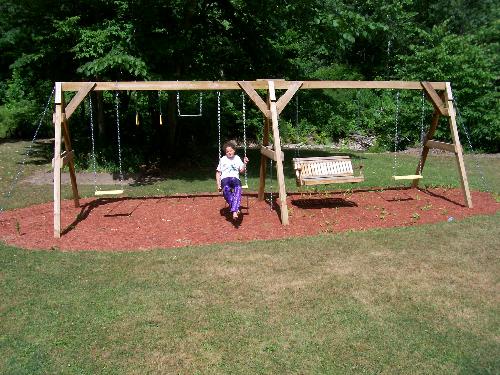 Swing set - This is the wooden swing set my sig. other made- It's great and perfect for us adults as well as my 10 year old daughter- We have had many talks on the porch swing in the middle-