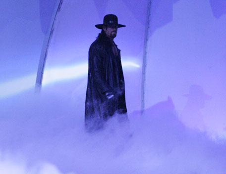 dead man walkin - the undertaker walkin through the smoke