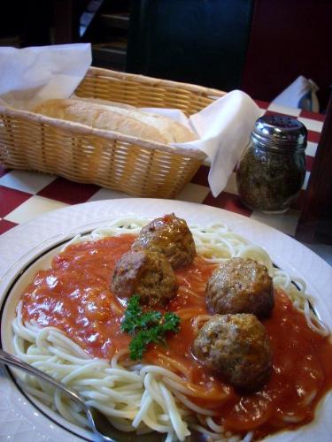 spaghetti with meatballs - spaghetti in red sauce with huge meatballs on top
