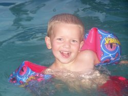 Cade swimming with arm floats - He swims really good with his arm floats. They are Spiderman to match his swim suit and everything else.