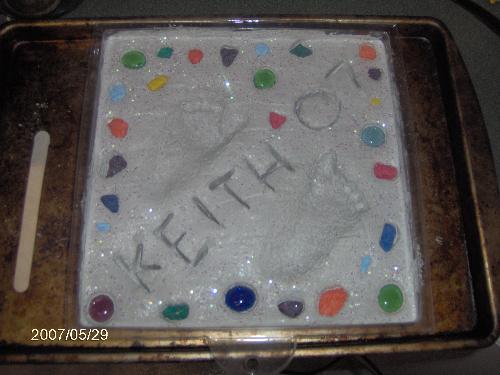 Keith's Stepping Stone 07 - This is the stepping stone i created for my son this year. You can hardly see his little foot prints, but they are there. It took a lot of tries to get his feet in the cement! Keith's Stepping Stone 07 - This is the stepping stone i created for my son this year. You can hardly see his little foot prints, but they are there. It took a lot of tries to get his feet in the cement!