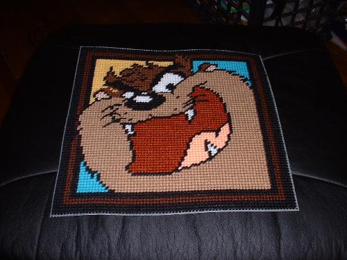 Front to a pillow - I started this project ages ago for my hubby and I would just love to finish it for him for xmas--its his favorite Looney Toons character--Taz. Its a plastic canvas pillow--you use the super soft canvas and do the front and a solid color back, stitch together on three sides, stuff, and then stick remaining side. I just love how this turned out. Front to a pillow - I started this project ages ago for my hubby and I would just love to finish it for him for xmas--its his favorite Looney Toons character--Taz. Its a plastic canvas pillow--you use the super soft canvas and do the front and a solid color back, stitch together on three sides, stuff, and then stick remaining side. I just love how this turned out.