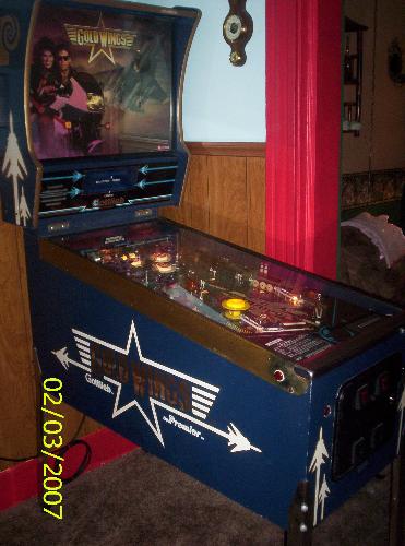 My Gottlieb Gold Wings Pinball - This is a pinball machine I purchased in the beginning of 2007. It is a 1986 Gottlieb/Premier Gold Wings. I bought it off of eBay at a great price. It was fully functional and the playfield was in awesome shape. Usually Gold Wings Machines have the gold playfield paint nearly worn off. It features digital scoring, a 2-ball multi-ball mode, air siren in the cabinet, and numerous targets to shoot for. It accepts quarters and is a great way to save money. Come on over and play, 5 balls for 25 cents.