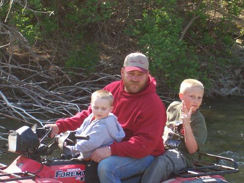 4-wheeling- - THis is my boyfriend and 2 nephews- They just hopped on the 4-wheeler for a slow small spin- Ended up in the crick riding-