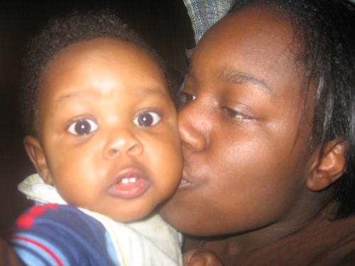 me & my son - This is a picture of me kissing my 11 month old son Jason. His birthday is coming up on the 27th.