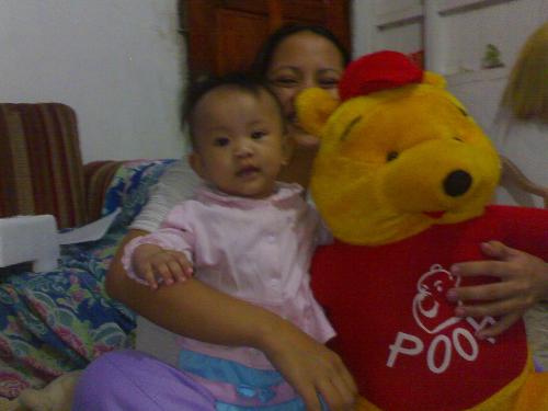 baby guia with winie d pooh - baby, mom and big toy