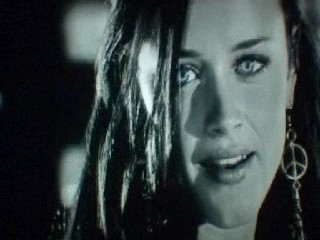 Alexis Bledel - In Sin City, Becky, Alexis Bledel, talking with the crooked cop outside his car, hopefully you can tell her blue eyes are the only color in the scene.