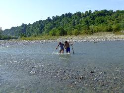 Me and Luci - I,m the one in blue shorts. We were crosing the river Prahova. My friend was helping me because I had a broken leg and the water was a bit fast.