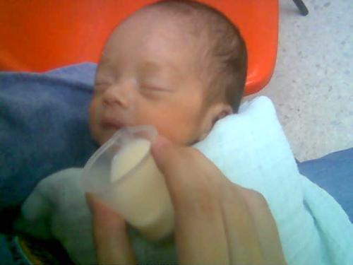 My premature baby while still in hospital. - Here is a picture of my premature baby boy. He was born at 29 weeks and he weights 1.25kg. From the picture you can see that my palm is bigger than his head!!