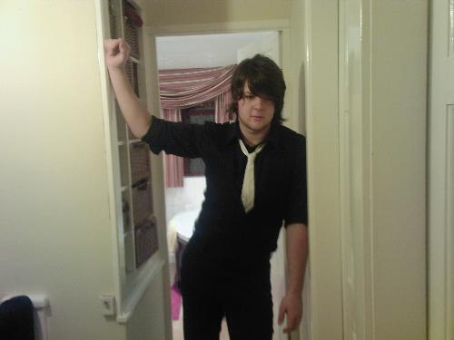 Me Standing - me standing in a doorway. that is my bathroom behind me.