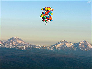 Oregon man takes lawn chair up to 13,000 feet -  Balloons suspend Kent Couch in a lawnchair as he floats in the skies near Bend, Ore., Saturday, July 7, 2007
