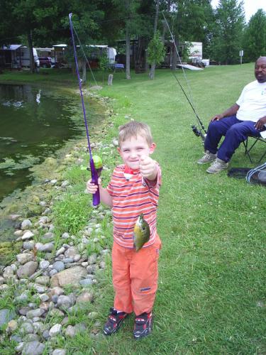 Elijah's 1st fish - This is my four year old son after catching his first fish ever! He actually caught two that day...fun stuff! I love this little guy soooo much!!