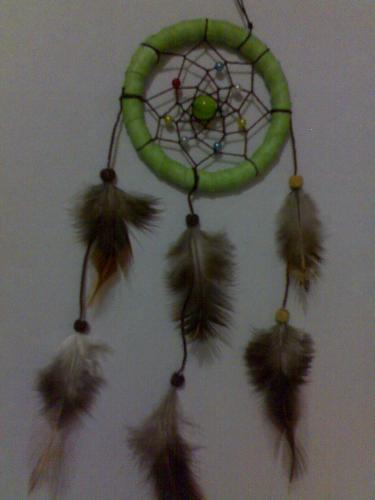 dreamcatcher - Native American Dreamcatcher Indians in green with 3 layers of feathers tied around the frame