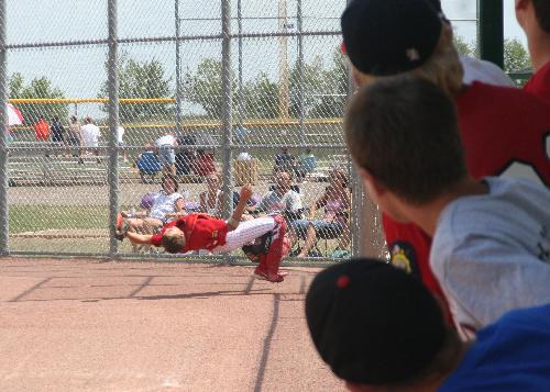 Making the Catch - Here the Catcher is making the catch of a foul ball. The ball was hit up behing the catcher but still in the field of play. He lost trach of the ball momentarly and when he located it it was behind him. He bent back to make the catch and fell backwards. I caught him just as he left his feet. He made the catch and was not hurt. After walking around to catch his breath he was ready for the next batter.
I was using a Canon Rebel with a Tamron 28-200 zoom lens. Making the Catch - Here the Catcher is making the catch of a foul ball. The ball was hit up behing the catcher but still in the field of play. He lost trach of the ball momentarly and when he located it it was behind him. He bent back to make the catch and fell backwards. I caught him just as he left his feet. He made the catch and was not hurt. After walking around to catch his breath he was ready for the next batter.
I was using a Canon Rebel with a Tamron 28-200 zoom lens.