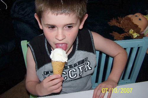 Wow, he&#039;s eating ice cream! - Autistic son eating ice cream. He won&#039;t, yet, eat the cone. But, at least he&#039;s trying a "normal" kid food.