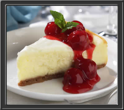 cheesecake - A really good looking piece of cheesecake with berries on top