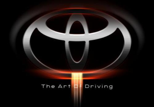 Toyota Logo Fire Background - Toyota Logo on black background with orange glow and 'The art of driving'