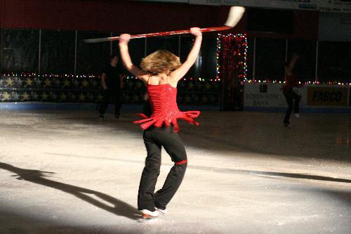 Figure Skater - Here you see the figure skater in motion and close enough with the light just right. This was shot with a Canon Rebel xt using a 50 mm 1.8 fixed lens. I was shooting at an ISO of 1600.