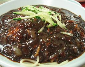 Jajangmyeon - It is a korean-chinese dish. it consists of handmade rice noodles, meat, veggies and black paste(it makes the noodles black). jajang meand 'fried sauce' and myeon meand 'noodle'.