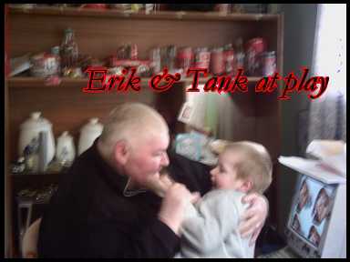my son and I joking round  - my computer, my youngest son at age 5yrs, in the back ground part of my cocacola collection