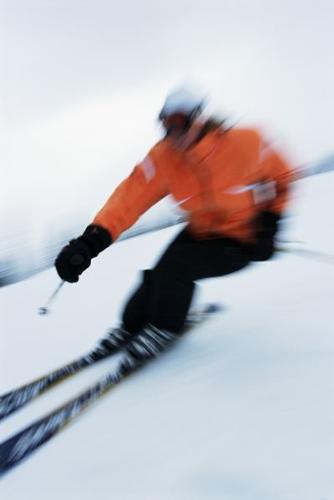 Skiing - in this sport you go down a mountain with snow, and you have skiis under your feet with two poles.