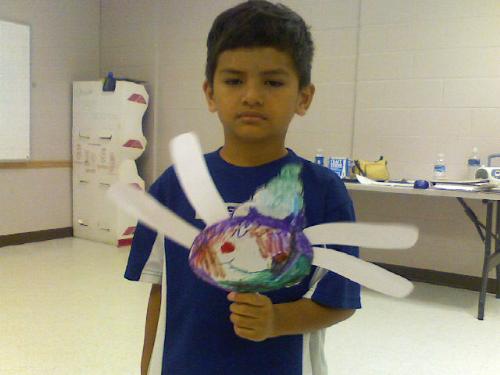 Time For A Haircut - My Son with his flower he made @ his mini doodlers class last week.