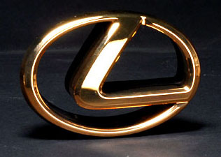 Gold Lexus Logo Front Emblem - Gold Lexus logo emblem on a grey background