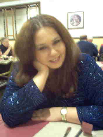 Just the QuixKid - I was waiting for dinner at a local restaurante prior to a Philharmonic Performance. The waitress snapped this shot of me.