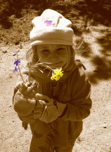 Ruthie - Ruth Moore giving flowers to whomever is holding the camera.