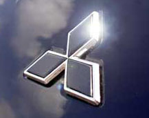 Chrome Mitsubishi Logo Front Emblem on Grey Car - Grey with white back Mitsubishi logo front emblem diagonal on grey back