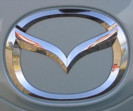 Chrome Mazda front logo emblem on silver 3 - Chrome Mazda front logo emblem on silver Mazda 3 sedan