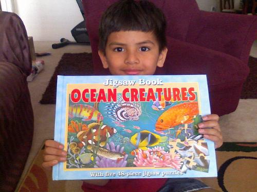 Maddy With One Of His Presents - A Ocean Creatures Jigsaw Story book