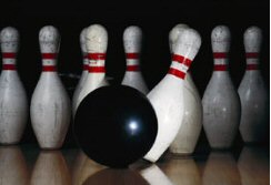 bowling - ball knocking over pins