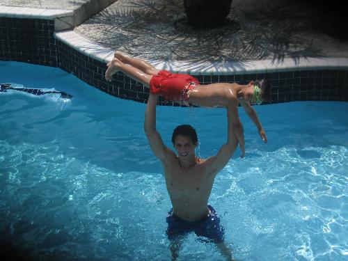 Me and my nephew - This is men holding my nephew jacob in my pool. I really like this picture... the water looks awesome