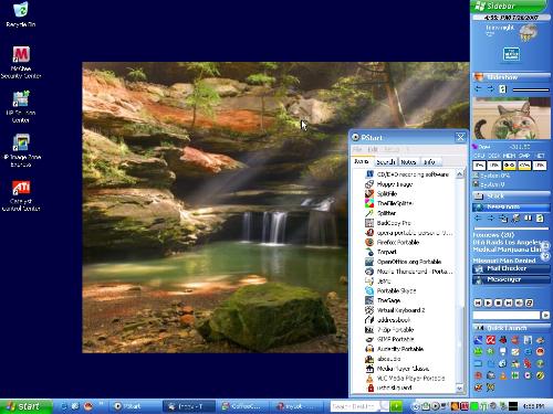 my desktop - Kind of crowded, but I'm comfy with it. Everything's close at hand for quick and easy access. :)