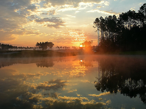 Sunset - Sun setting over water.