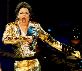 Micheal Jackson  - Micheal Jackson on a stage show in 1996 wearing gold color costumes