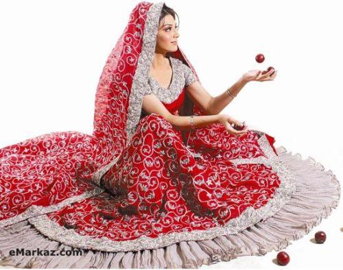 indian bridal photo - in india and pakistan generally brides prefer to wear red colour dress .it is a sharara or ghagra generally named. .now adays there are many other colours are in fashion. but red maroon are most commonly used.it looks very nice and beatiful. with lot of emriodery and work like zary and many traditional type of wotk is used .the price ranges from 1one thousand to lakhs.