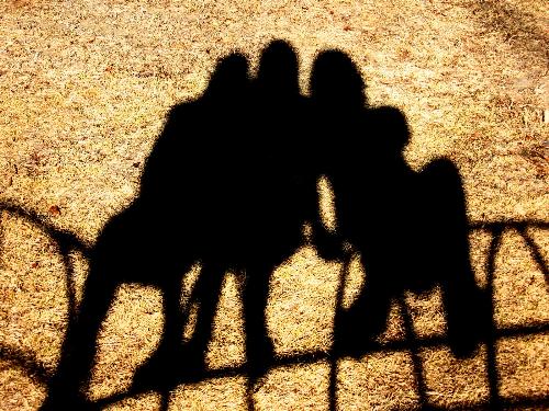 best friends - This is me and my best friends sitting on a playground structure. The photo is specifically our shadows, creating an artistic effect.