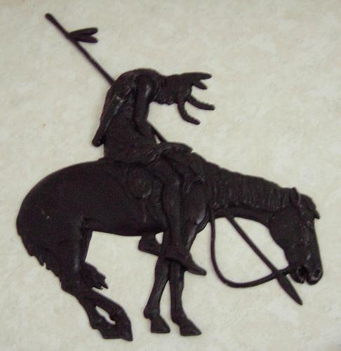 Trail of Tears - This is an iron art piece that I have hanging on my wall. It is one of many pieces of Native American art that I own.