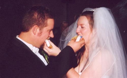 sharing bites of cake - We had such a wonderful wedding. The cake was delicious!