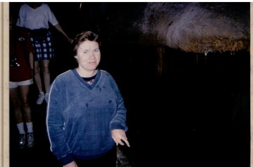 Mammoth Cave - I visited Mammoth Cave with my family several years ago. In this photo I am making my way along the narrow path between a high cave wall and a ravine that was deep enough you couldn't see bottom. I was grateful for the handrail.