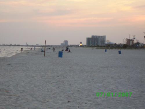 Biloxi, MS  - A beach in Biloxi, MS at sunset.