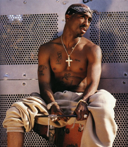 2Pac - Tupac is sitting on a box. Good picture.