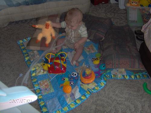 KJ and his favorite monkey - This is my son playing on the floor of the living room