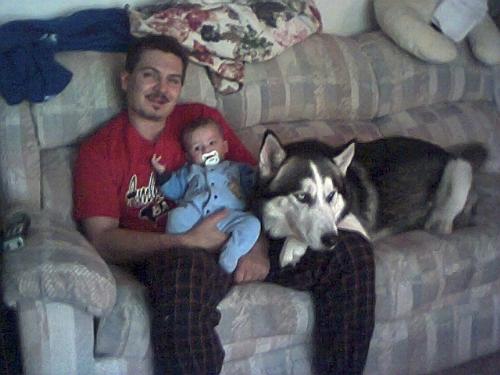 The Boys - This picture is of my Boyfriend Harry, Our son Dylan and our Siberian Husky dog Damon all sitting on our couch at home.