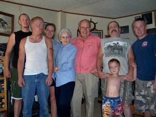 My Children, Husband and My In-Laws - This photo shows from left to right...Larry, my son-in-law; Peter, my eldest son; Becca,my only daughter; Minnie, my mother-in-law; Joe Ray, my father-in-law; Michael, my husband; Travis, our middle son and Alex is our youngest and he is standing in front of his Dad...