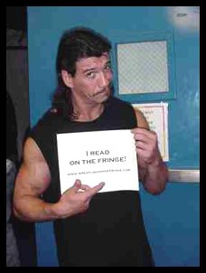 Eddie Guerrero holding my website sign - Eddie Guerrero was my closest friend in wrestling and I was devastated by his death. This is him holding up a sign saying he read my website, The Fringe. He was a wonderful friend, man, and performer and I will remember him always. RIP, mi amigo.