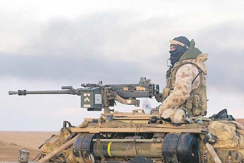Australian Special Air Service Operator - Australian SAS operator, as seen behind .50cal machine gun, mounted on SAS customised 6x6 Land Rover Special Operations vehicle